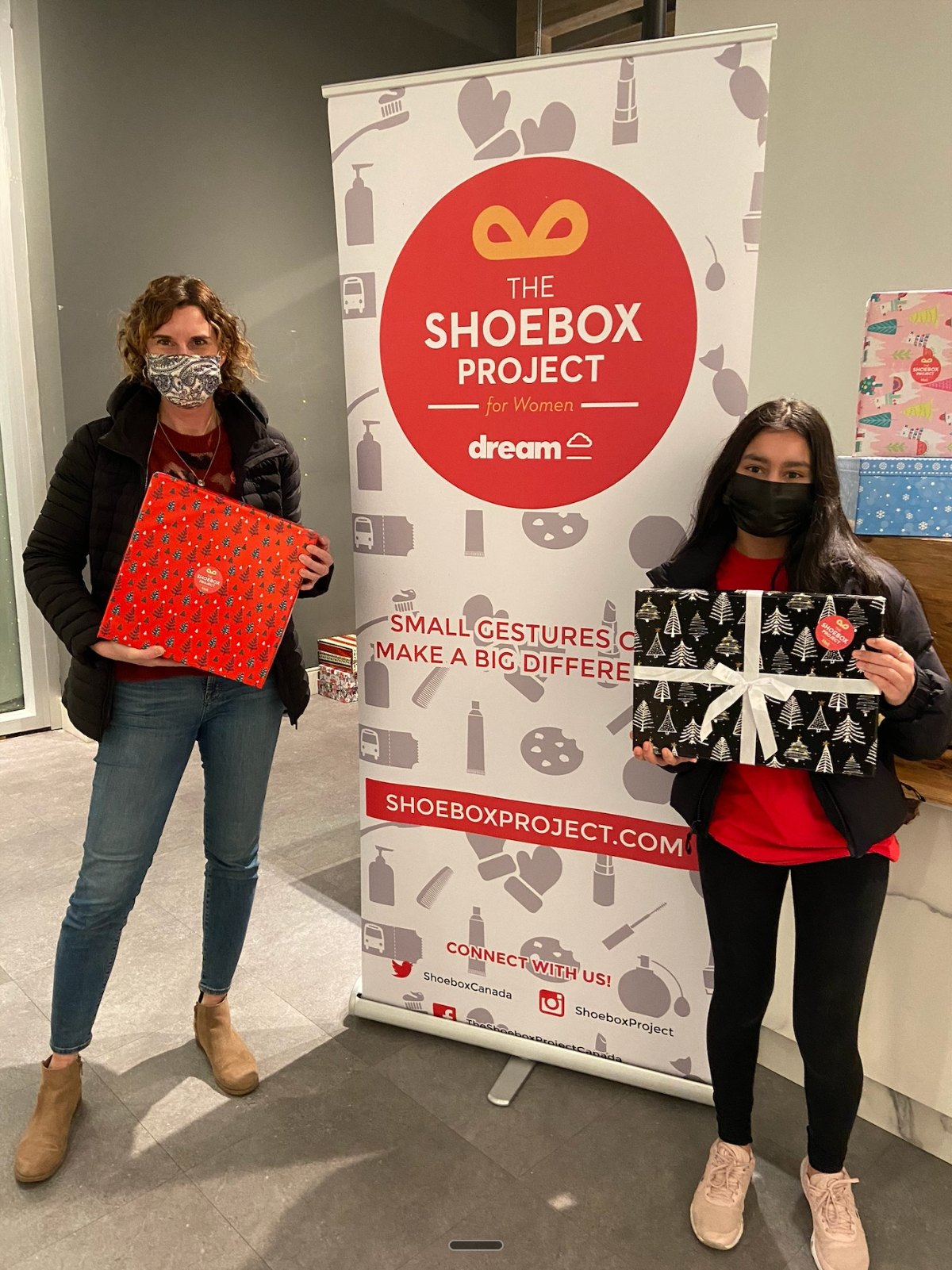 Donating gift boxes at a Shoebox Project event